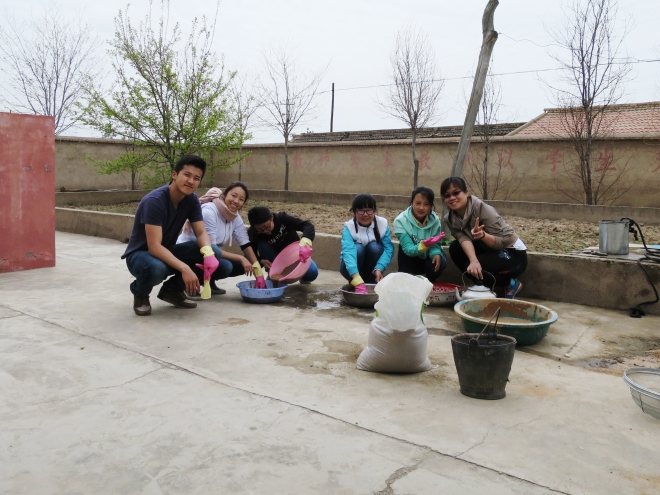 Washing sand to build a biosand water filter in Gansu!